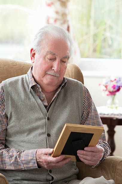 istock Senior Man Holding A Photo Frame 481281807