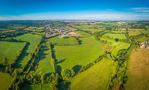 istock Country town in patchwork pasture landscape summer green fields panorama 481282931