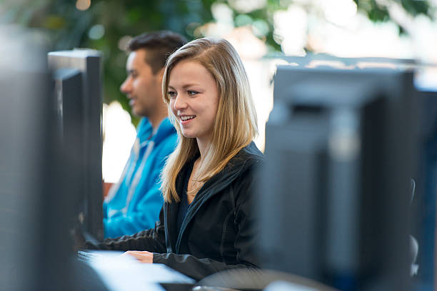 Adult Student Using Computer Hispanic Adult College Students Studying Together In Computer Lab Stock ...