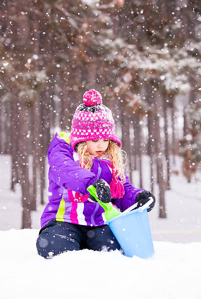 istock Girl Playing in Snow 481283339