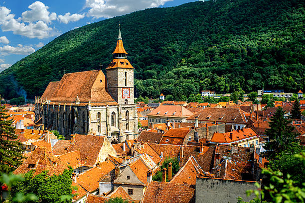 Brasov cityscape in Romania Brasov cityscape with black cathedral and mountain on backround in Romania romania stock pictures, royalty-free photos & images
