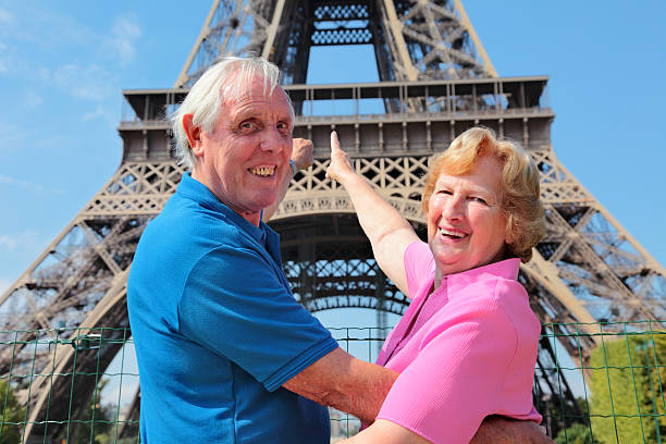 istock Senior couple in front of Eiffel Tower 481287031