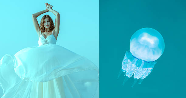 istock Girl in white dress and jellyfish 481287310