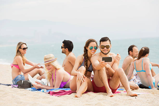 istock Happy friends doing selfie at sea shore 481287380