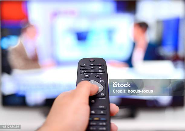Watching News On Tv Stock Photo - Download Image Now - Television Industry, Television Set, Computer Monitor