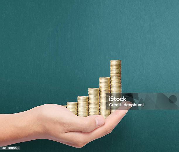Hand Put Coin To Money Stock Photo - Download Image Now - Stack, Coin, Stacking