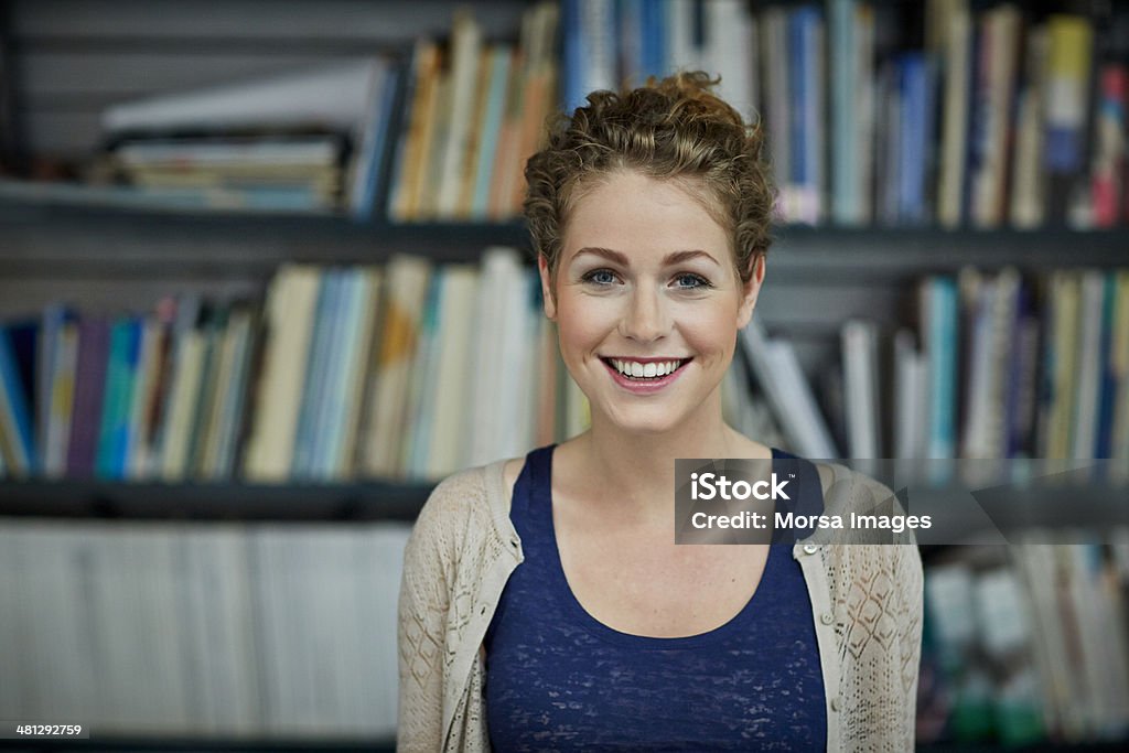 Portrait of young architect Portrait of young smiling architect in studio Women Stock Photo