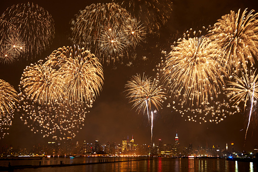 Beautiful colorful fireworks against a dark sky background. Selective focus, background, texture.