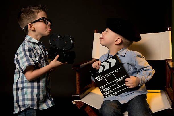 istock Two little boy playing role director and cameraman suite 4 481297302