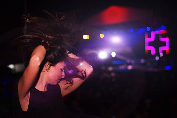 istock Girl dancing at concert 481300372