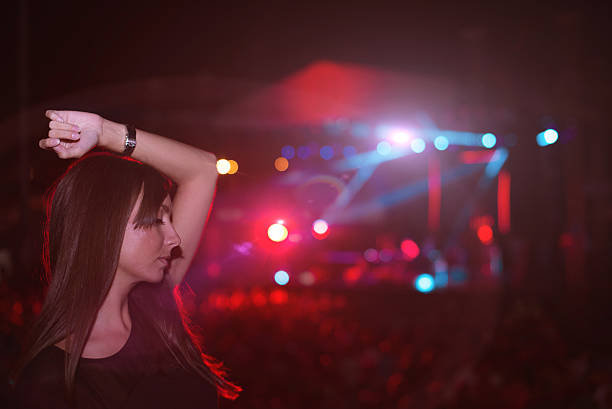 istock Girl dancing at concert 481300384