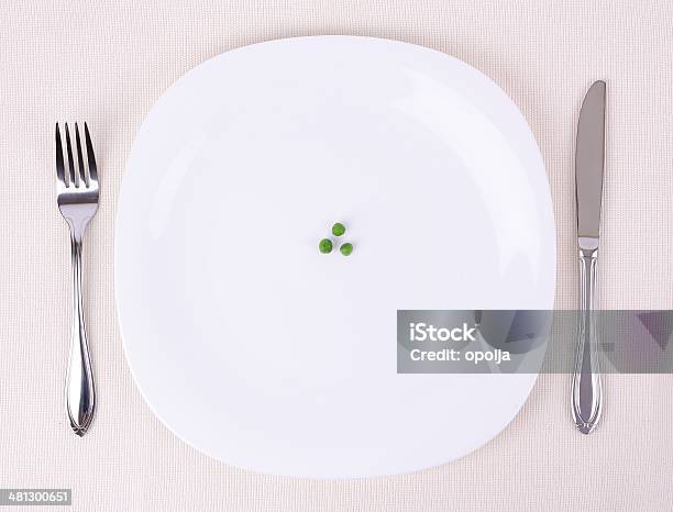 Small Portion Of Food On A Big Plate Stock Photo - Download Image Now - Small, Dieting, Healthy Eating