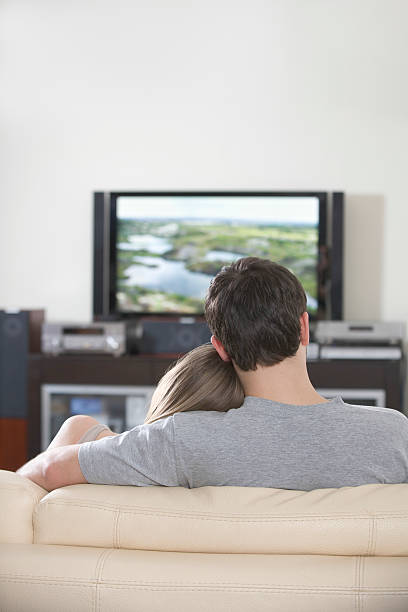 istock Couple Watching TV Together At Home 481300693