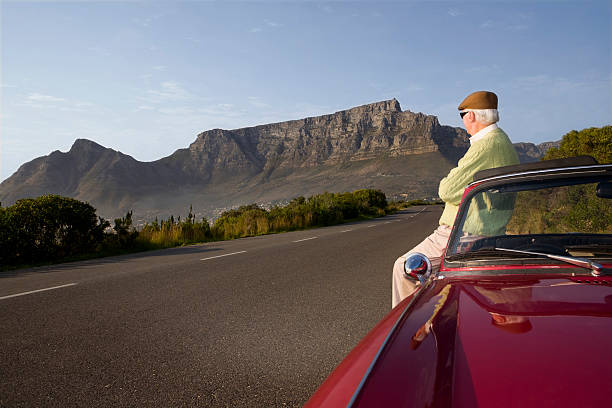 istock Senior Man Looking At Sight Standing Besides Car 481302141