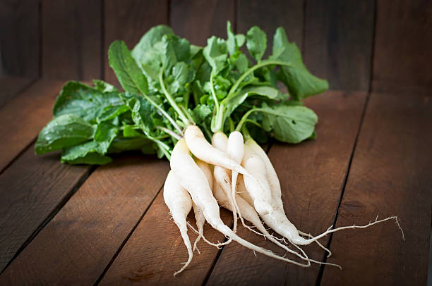istock Fresh daikon radish on a wooden background 481304282