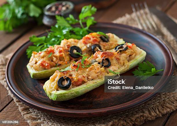 Stuffed Zucchini With Chicken Tomatoes And Olives With Cheese Crust Stock Photo - Download Image Now