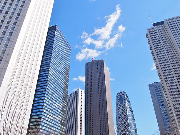 grattacieli di tokyo - shimbashi district skyscraper building exterior low angle view foto e immagini stock