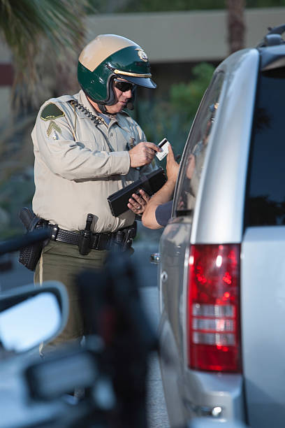 istock Traffic Cop Receiving Credit Card From Driver 481308099