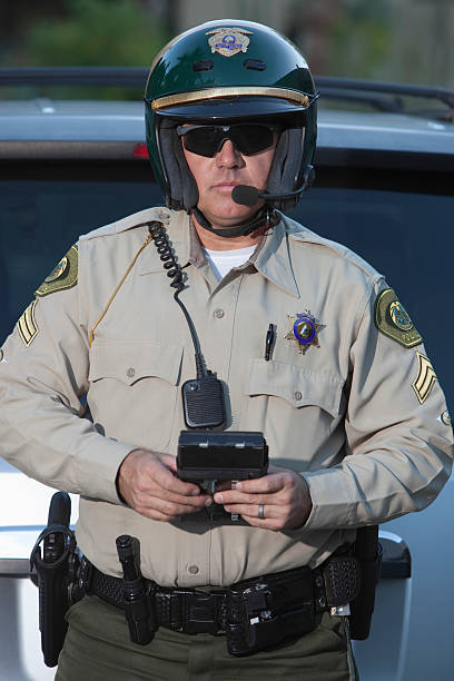 istock Traffic Cop With Clipboard Standing Against Car 481308103