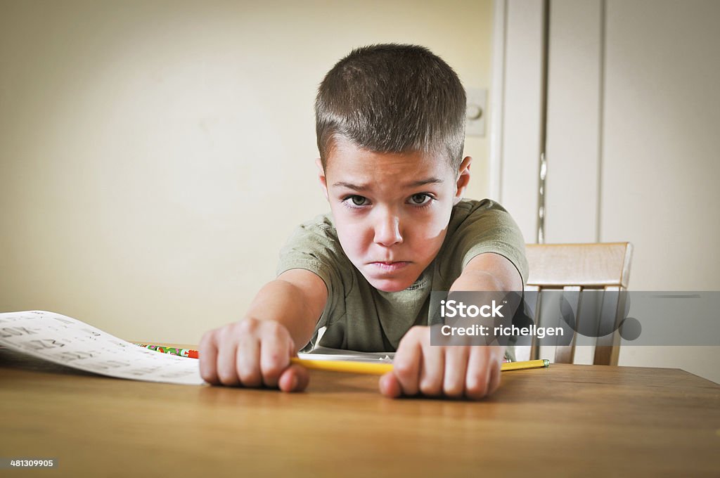 Homework difficulties A young boy doing homework and is getting frustrated. Horizontal image with copy space. 6-7 Years Stock Photo