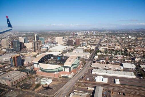 Phoenix, United States - November 20, 2011: Aerial view of downtown Phoenix, Arizona.  Chase Field is prominent in the picture.  It is home of the Diamondbacks baseball team.  It opened in spring of 1998 to house Arizona's first major league baseball team.  The ballpark covers 1,300,000 sq ft. It can be configured to accommodate football, soccer, & basketball.