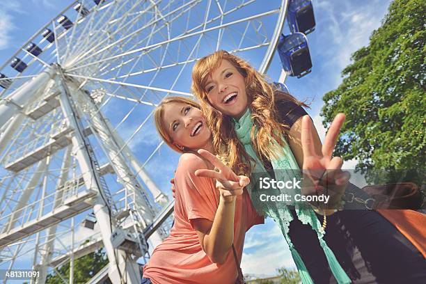 Young Friends In The Amusement Park Stock Photo - Download Image Now - Adult, Agricultural Fair, Amusement Park