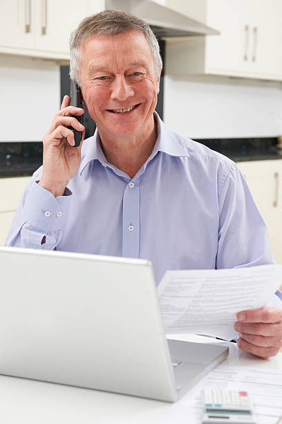 istock Senior Man Checking Finances On The Phone 481311487
