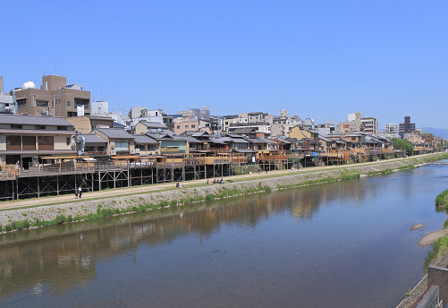 Kyoto Japan - May 5, 2015: People visit beautiful Kamo river in Kyoto city centre Japan. 