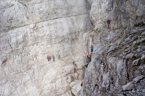 Madonna di Campiglio, Brenta, Italy – September 12, 2013: Polish climbers are following on via Ferrata SOSAT, Dolomites Brenta