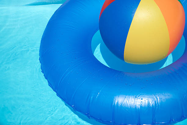 istock Floating tire and Beach Ball 481315594