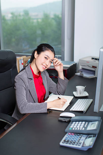 istock business woman at office 481316012