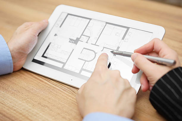 istock real estate agent showing home projection on tablet  computer 481319128