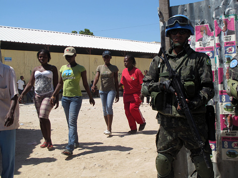 Port-au-Prince, Haiti - March 20, 2011:  Brazilian United Nations peacekeeping troops provide security outside a polling place during the presidential run-off election.  The run-off pitted Mirlande Manigat of the RDNP party against Michel Martelly of the Repons Peyizan party, the eventual winner.