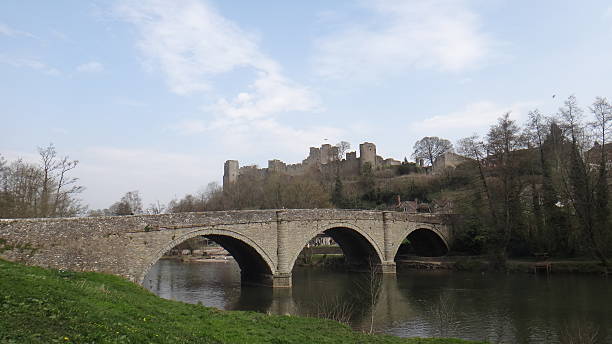 Ludlow at Summer A Spring shot looking out across Ludlow bridge with a clear view of the castle walls ludlow shropshire stock pictures, royalty-free photos & images