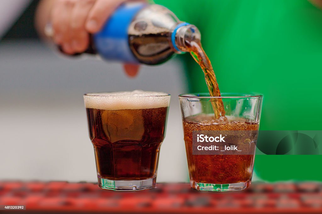Carbonated drink poured into a glass Pouring Stock Photo