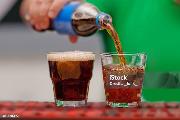 Carbonated Drink Poured Into A Glass Stock Photo - Download Image Now - Pouring, Soda, Carbonated