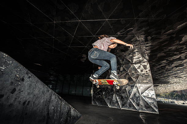 istock Young teenager jumping with her skateboard 481321748