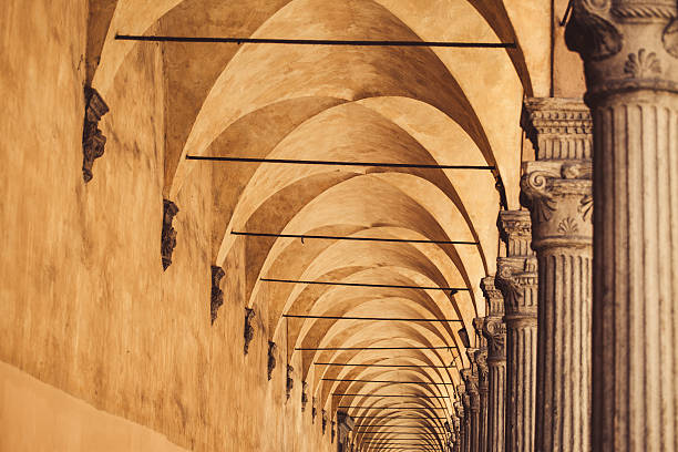Typical portico in Bologna, Italy long rows of arches and columns bologna photos stock pictures, royalty-free photos & images