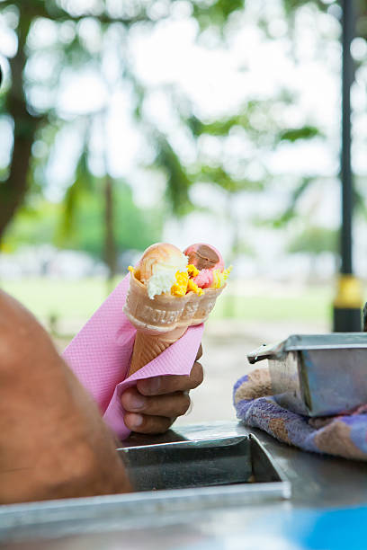istock yellow passion fruit and red strawberry ice cream cones 481326356