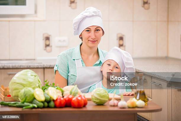 Mother With Her Baby Chefs Stock Photo - Download Image Now - 2015, Adult, Apron