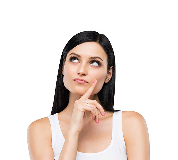 istock pensive brunette lady in a white tank top. Isolated. 481329118