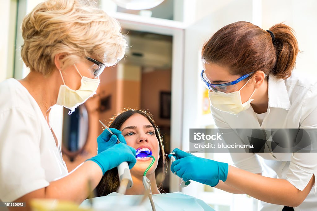 Dentist's surgery Ultraviolet light procedure at dentist office 20-24 Years Stock Photo