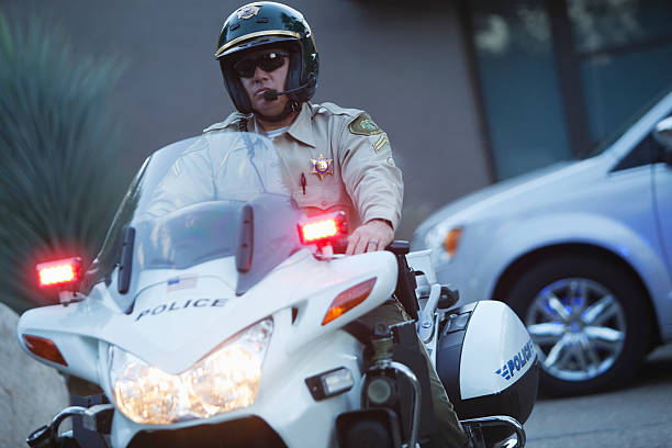 istock Traffic Cop Wearing Helmet While Riding Motorbike 481330921