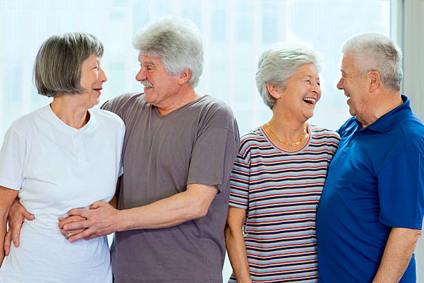 istock Seniors Enjoying Conversation In Community Center 481332001