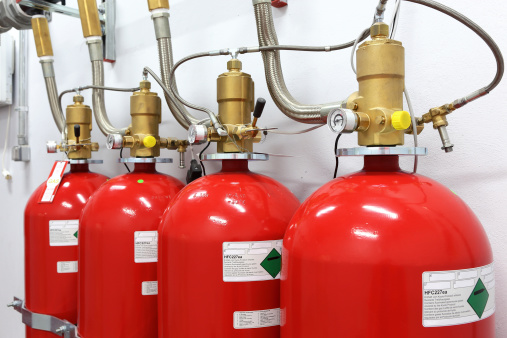 Heptafluoropropane tubes of a gaseous fire suppression system. Canisters containing Heptafluoropropane (HFC227ea) gas for use in extinguishing a fire in a public transportation network without damaging equipment. The items, which are connected to ventilation system of the network, are in stand-by position under control of a fire detection system.