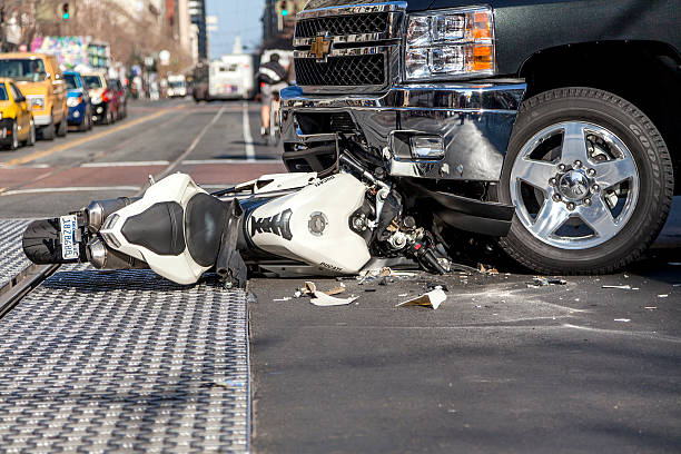 Crash San Francisco, USA - January 23, 2014: A bad traffic accident between a white Ducati motorcycle and Chevy pickup truck occurred on Market street in the late afternoon and brought traffic to a halt, backing up Muni buses and light rain trains. No fatalities were reported. motorbike stock pictures, royalty-free photos & images