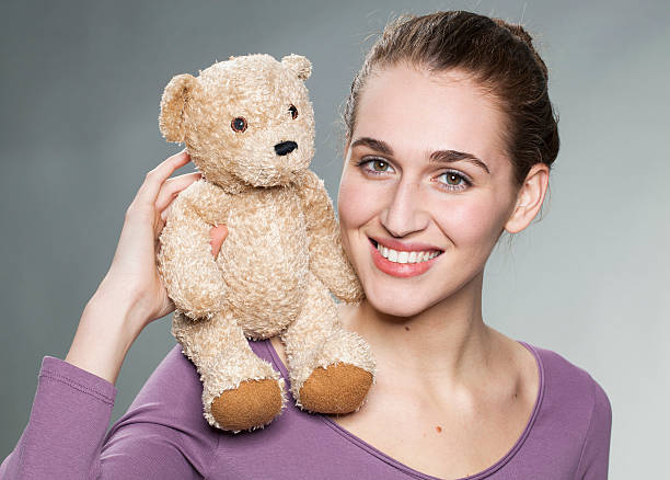 istock joyful 20s girl holding her favorite comforter with emotion 481333002