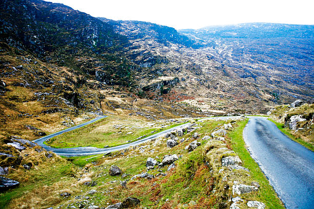 Road twisting and turning through the mountains in Ireland