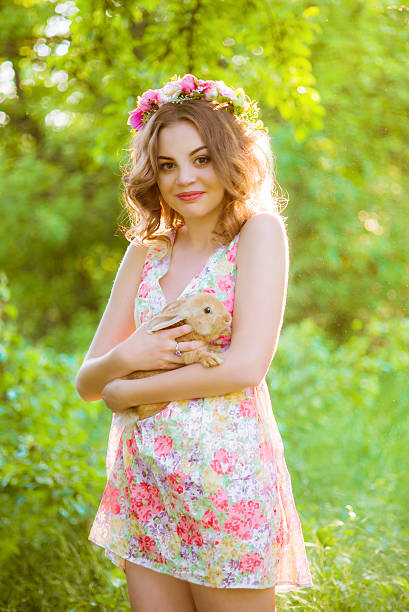 istock Beautiful girl with a rabbit in the hands 481333410
