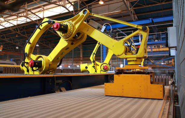 istock Automated production line robots picking up bricks on a conveyor 481337939